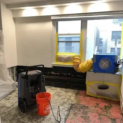 Drying equipment ready to set up for a water damage job in a home
